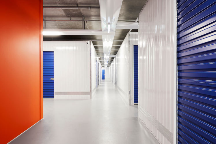Smiling StorHub staff members in the Rouse Hill self storage facility 